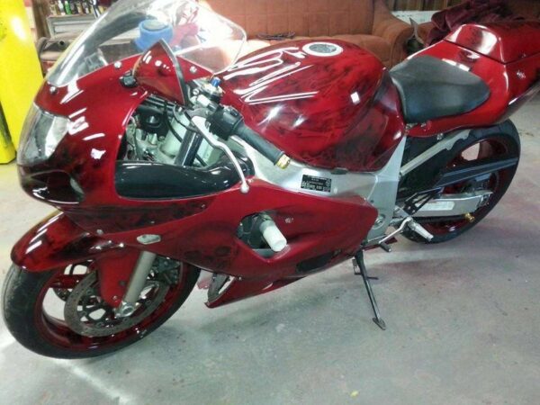 Ruby Red Kandy Pearls painted on a user's bike.