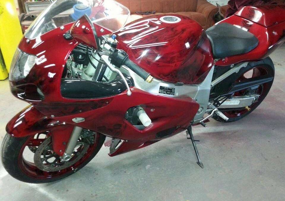Ruby Red Kandy Pearls painted on a user's bike.