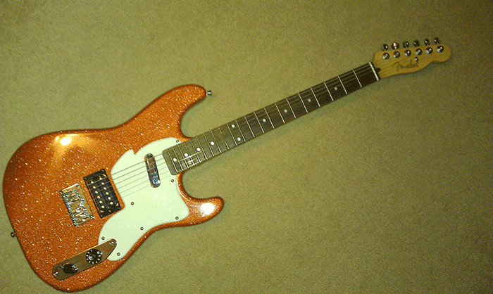 This is a Kustom Paint Job using our metal flake guitar paint additive, Orange Copper Metal Flake.